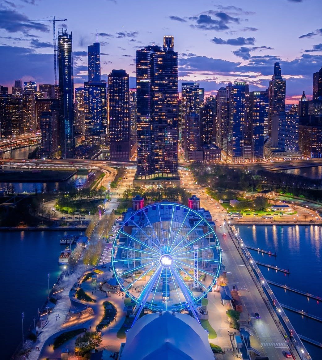 Navy Pier and its wheel lit at night